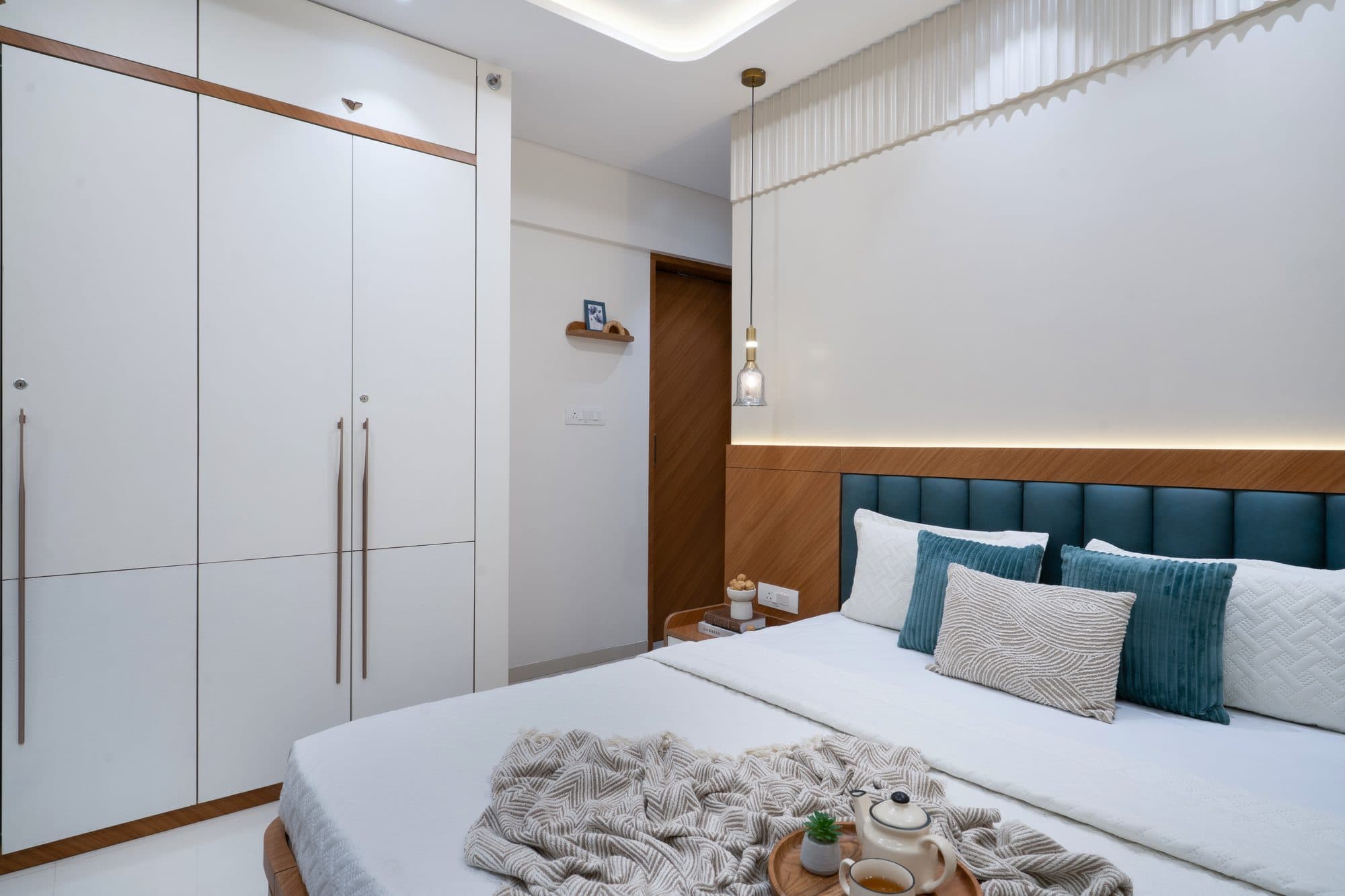 Master Bedroom in a Ravet, Pune home by Divya Jain Interiors